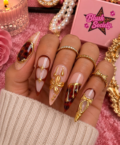 Amber Bow Luxe long press-on nails modeled on hand by Blush Society