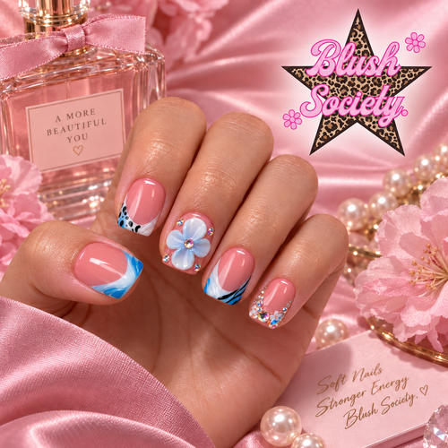 Blue Bloom press-on nails modeled on hand